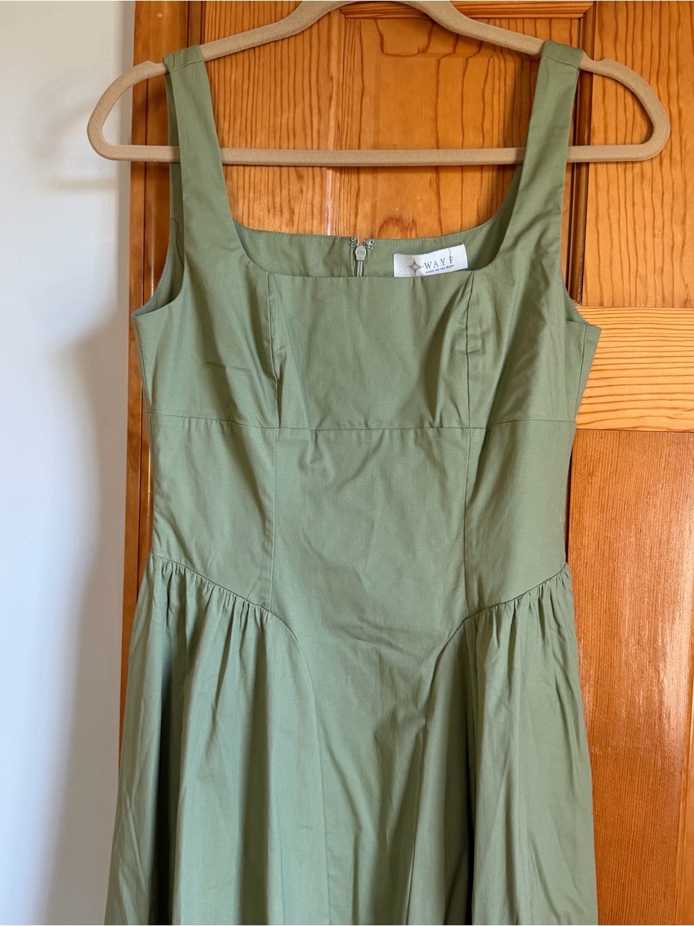 Olive green jacket with tag